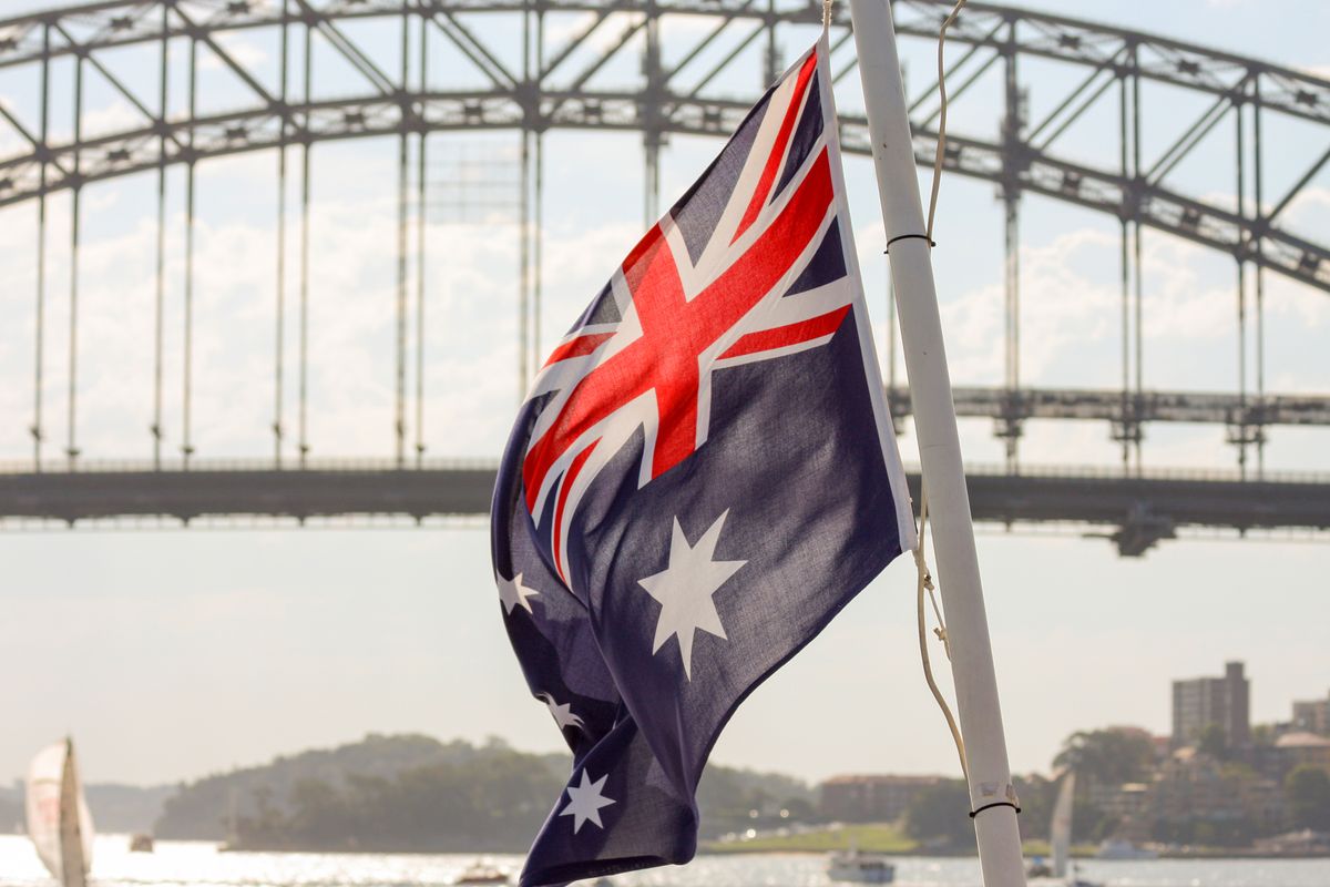 Australian,Flag,With,Sydney,Harbor,Bridge,In,Background
Australian flag with Sydney Harbor bridge in background