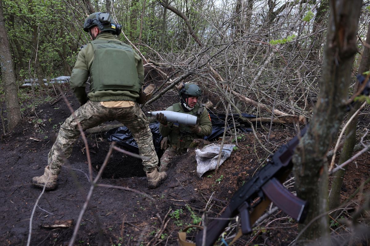 Ukrainian artillerymen of the Aidar battalion work with artillery shells on a front line position near Bakhmut, Donetsk region, on April 22, 2023, amid the Russian invasion on Ukraine.