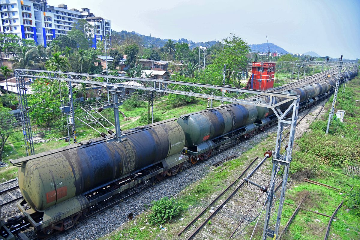An oil tankers train passes near the Guwahati Refinery operated by Indian Oil Corporation, in Guwahati on March 30, 2023. - On March 29 Russian oil giant Rosneft announced a deal with Indian Oil to substantially increase oil supplies to the firm. India has emerged as a major buyer of Russian oil since the Ukraine war. (Photo by Biju BORO / AFP)