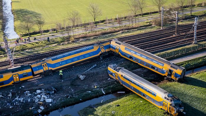 Voorschoten - Emergency services at work at a derailed night train. The passenger train collided with construction equipment on the track. One person died and several people were seriously injured. A freight train was also involved in the accident. ANP REMKO DE WAAL netherlands out - belgium out (Photo by REMKO DE WAAL / ANP MAG / ANP via AFP)