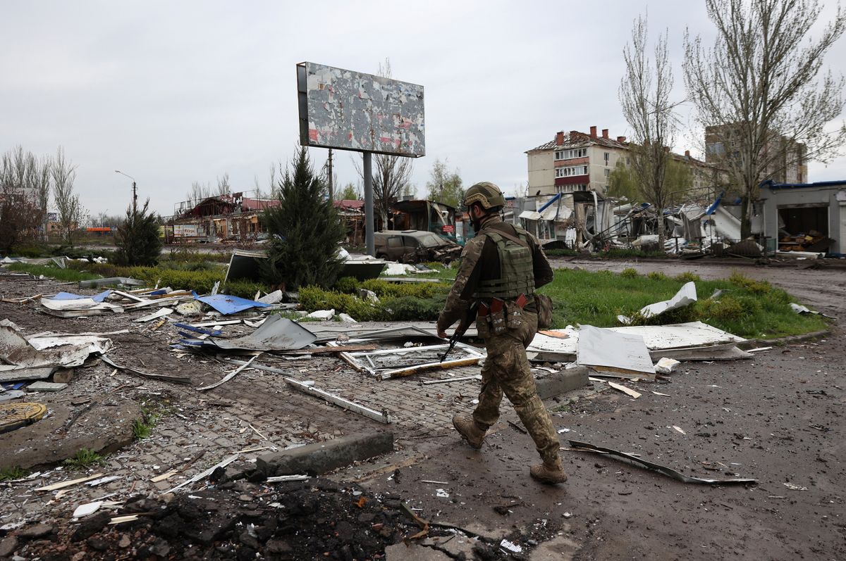 EDITORS NOTE: Graphic content / An Ukrainian serviceman walks down a street in the frontline city of Bakhmut, Donetsk region on April 23, 2023, amid the Russian invasion of Ukraine.