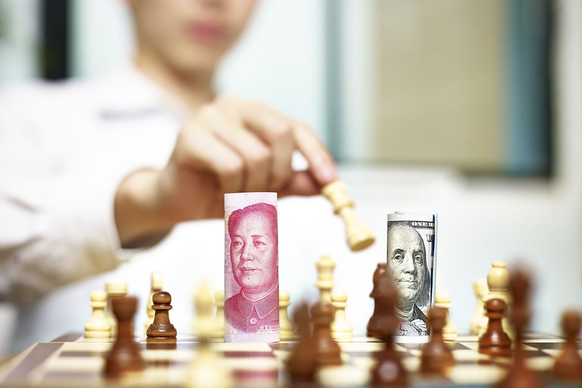 U.s.,Dollar,(usd),And,Chinese,Yuan,(cny,Or,Rmb),Bills
U.S. Dollar (USD) and Chinese Yuan (CNY or RMB) bills on a chess board, concept for currency games.