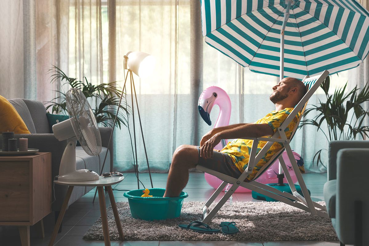 Bored,Man,Spending,Summer,Vacations,At,Home,And,Pretending,He
Bored man spending summer vacations at home and pretending he is on the beach, he is sunbathing in his living room and resting on a deckchair