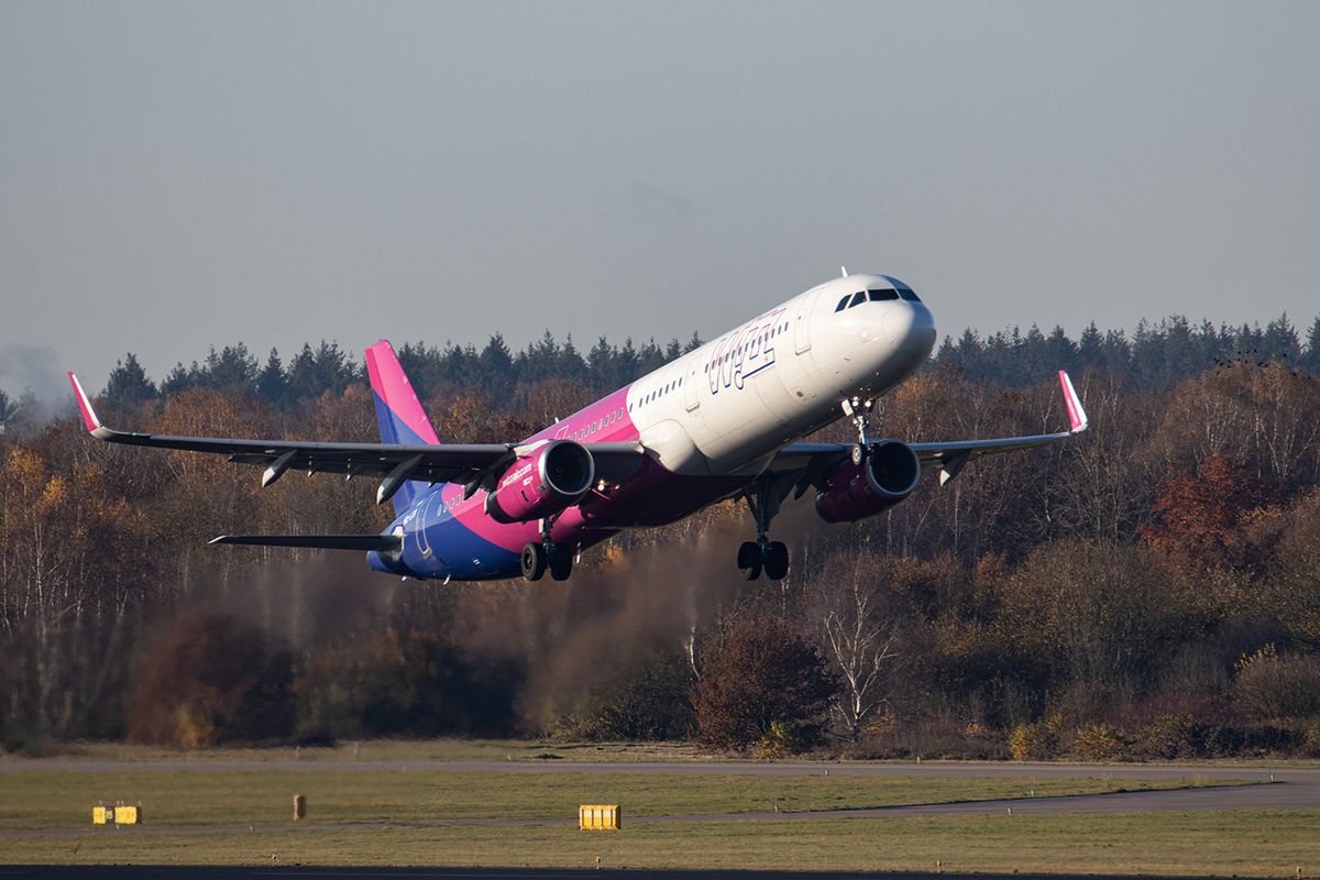 Wizz Air Airbus A321 Departing From Eindhoven
Wizz Air Airbus A321 aircraft as seen during taxiing, take off and flying phase departing from Eindhoven airport EIN during a blue sky sunny winter day.  W!ZZ Air is a Hungarian Ultra Low Cost Airline Carrier with the largest bases at Budapest Airport and Luton Airport flying to 164 airports. The A321-200 plane with the logo inscription on the side has the registration HA-LXV. The world aviation industry is trying to recover from the negative impact of the Covid-19 Coronavirus pandemic. Eindhoven, The Netherlands on November 22, 2021 (Photo by Nicolas Economou/NurPhoto via Getty Images)