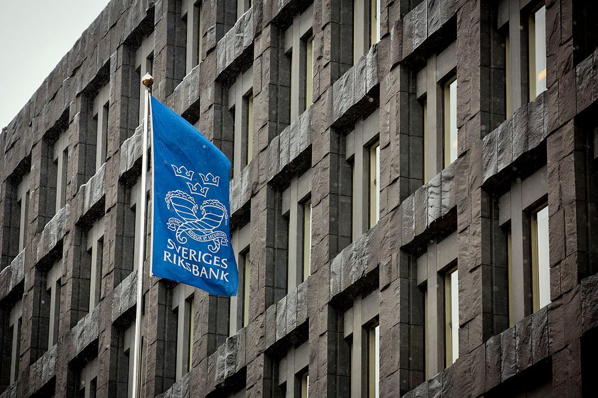 Recession-Beset Scandinavia Seen Least Ugly as Returns Sink
A flag flies outside the headquarters of the Riksbank, Sweden's central bank, in Stockholm, Sweden, on Thursday, Nov. 29, 2012. Sweden's Riksbank is unlikely to back proposals for a cap on banks' foreign borrowing even after the government and regulator warned that the industry is too reliant on international funding markets. Photographer: Casper Hedberg/Bloomberg via Getty Images