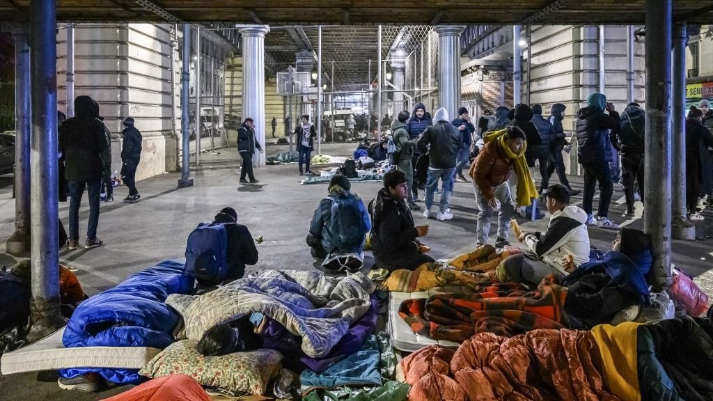 Refugees try to survive at the Stalingrad Subway Station in Paris