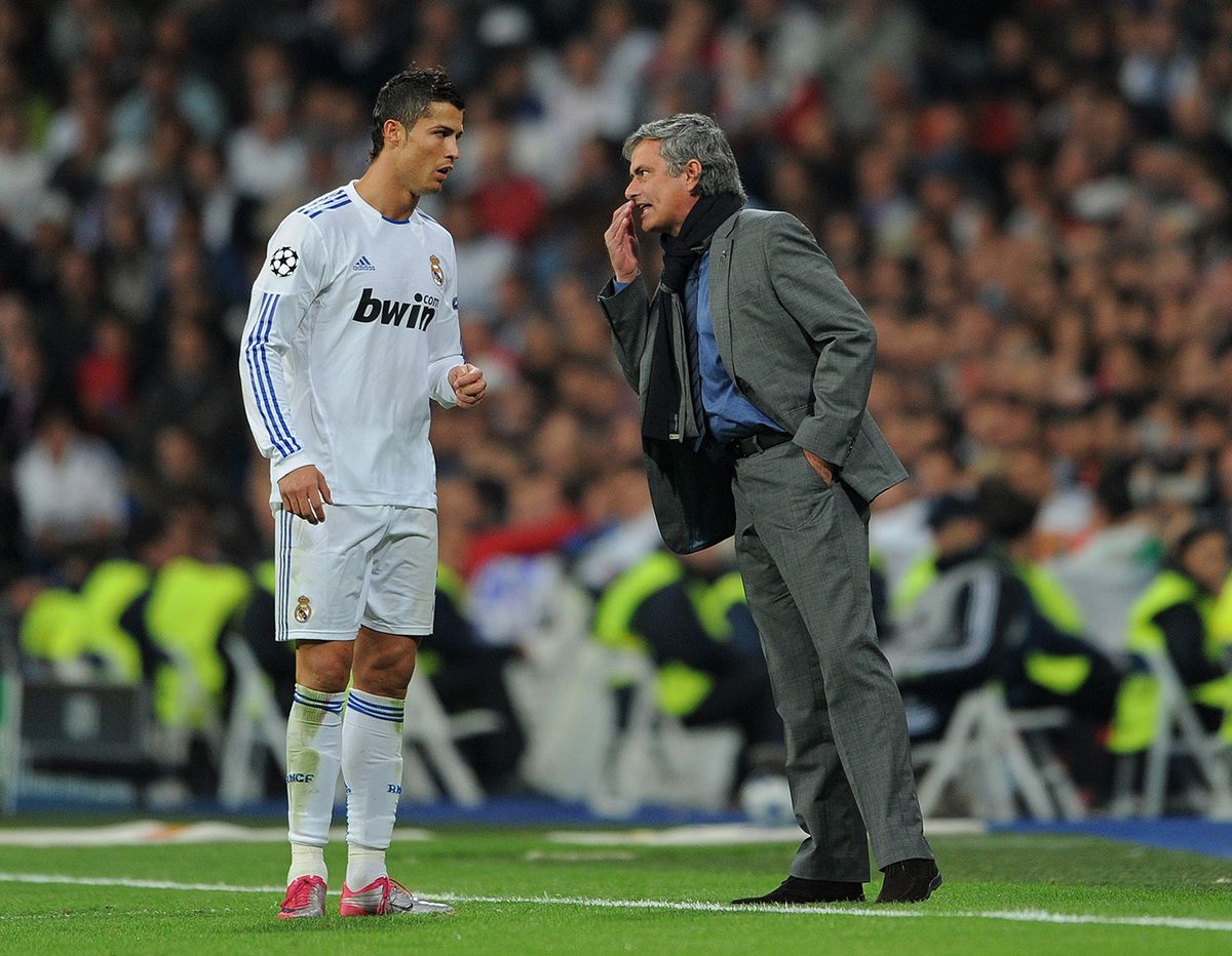 Real Madrid v AC Milan - UEFA Champions League
MADRID, SPAIN - OCTOBER 19:  Head Coach Jose Mourinho (R) of Real Madrid instructs Cristiano Ronaldo during the UEFA Champions League group G match between Real Madrid and AC Milan at the Estadio Santiago Bernabeu on October 19, 2010 in Madrid, Spain.  (Photo by Jasper Juinen/Getty Images)
