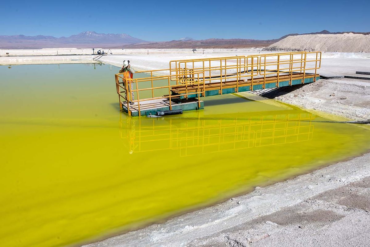 Chile Mines Lithium From Salt Flats Of Atacama Desert
SALAR DE ATACAMA, CHILE - AUGUST 24: A lithium mine supervisor inspects an evaporation pond of lithium-rich brine in the Atacama Desert on August 24, 2022 in Salar de Atacama, Chile. Albemarle Corporation, based in Charlotte, N.C. is expanding mining operations at their Salar Plant to meet the rising global demand for lithium carbonate, a main component in the manufacture of batteries, increasingly for electric vehicles. To extract the lithium, natural brine is pumped from under the salt flats to a series of evaporation ponds. During an 18-month process, the liquid s moved through 15 ponds, eventually turning from blue to yellow with a lithium concentration of 6 percent. It is then trucked to an Albemarle chemical plant in Antofagasta, where it is processed into battery grade lithium carbonate powder and shipped out internationally. The evaporation process produces large quantities of salt byproduct, much of which is then reprocessed and sold. Chile is the second largest global producer of lithium, after Australia. (Photo by John Moore/Getty Images)