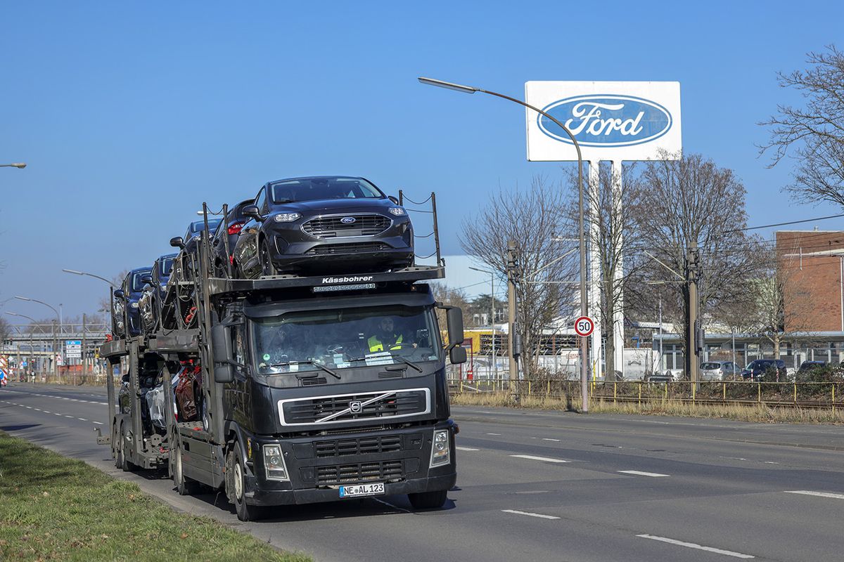 Ford Cutting 3,800 Jobs as EV Shift Shrinks German, UK Workforce
A truck transports Ford Motor Co. vehicles outside the automaker's plant in Cologne, Germany, on Tuesday, Feb. 14, 2023. Ford will dismiss some 11% of its workforce in Europe in the latest sign of industrial disruption caused by the automotive sectors shift to electric vehicles. Photographer: Alex Kraus/Bloomberg via Getty Images