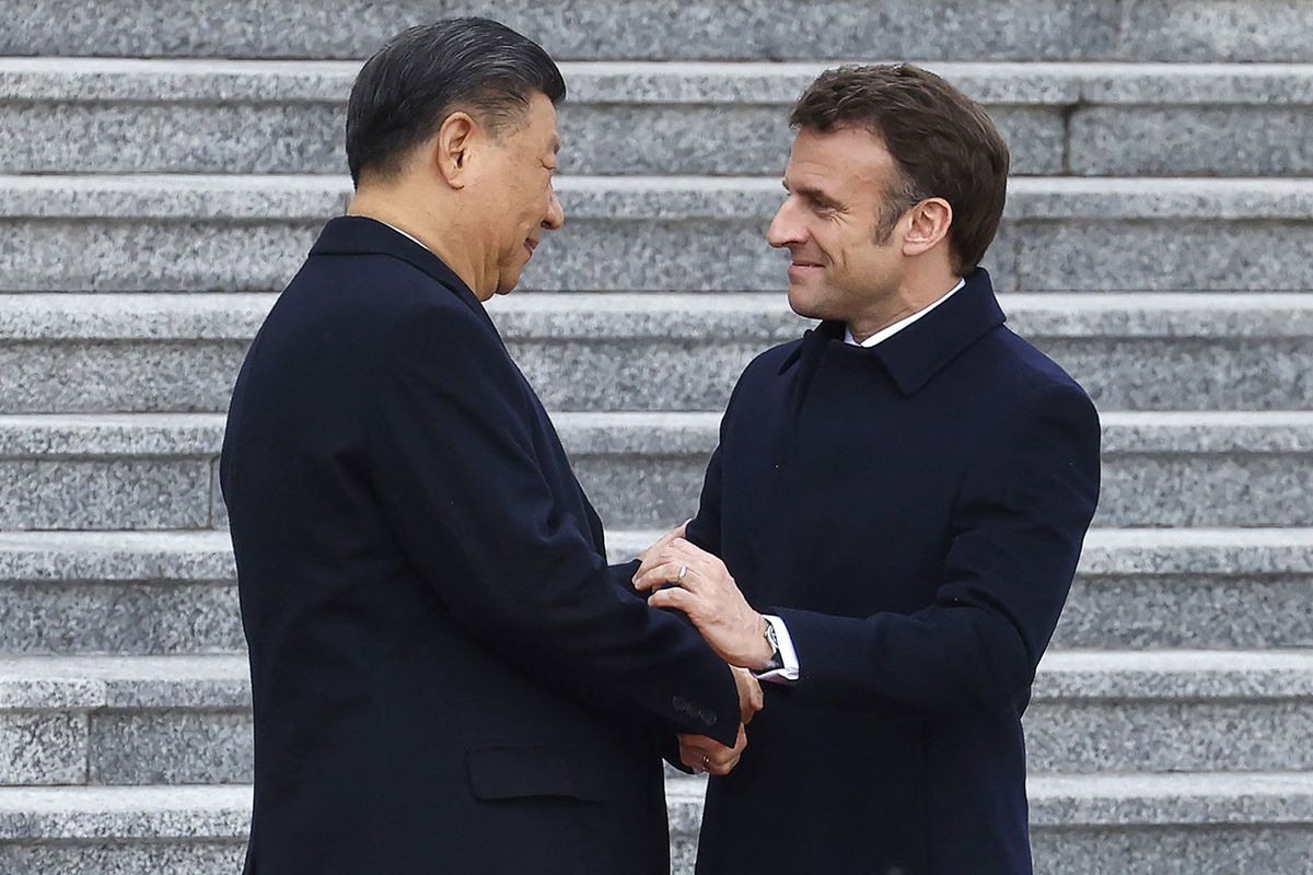 China's President Xi Jinping (L) shakes hands with his French counterpart Emmanuel Macron as they attend the official welcoming ceremony in Beijing on April 6, 2023. (Photo by LUDOVIC MARIN / AFP)
CHINA-FRANCE-DIPLOMACY