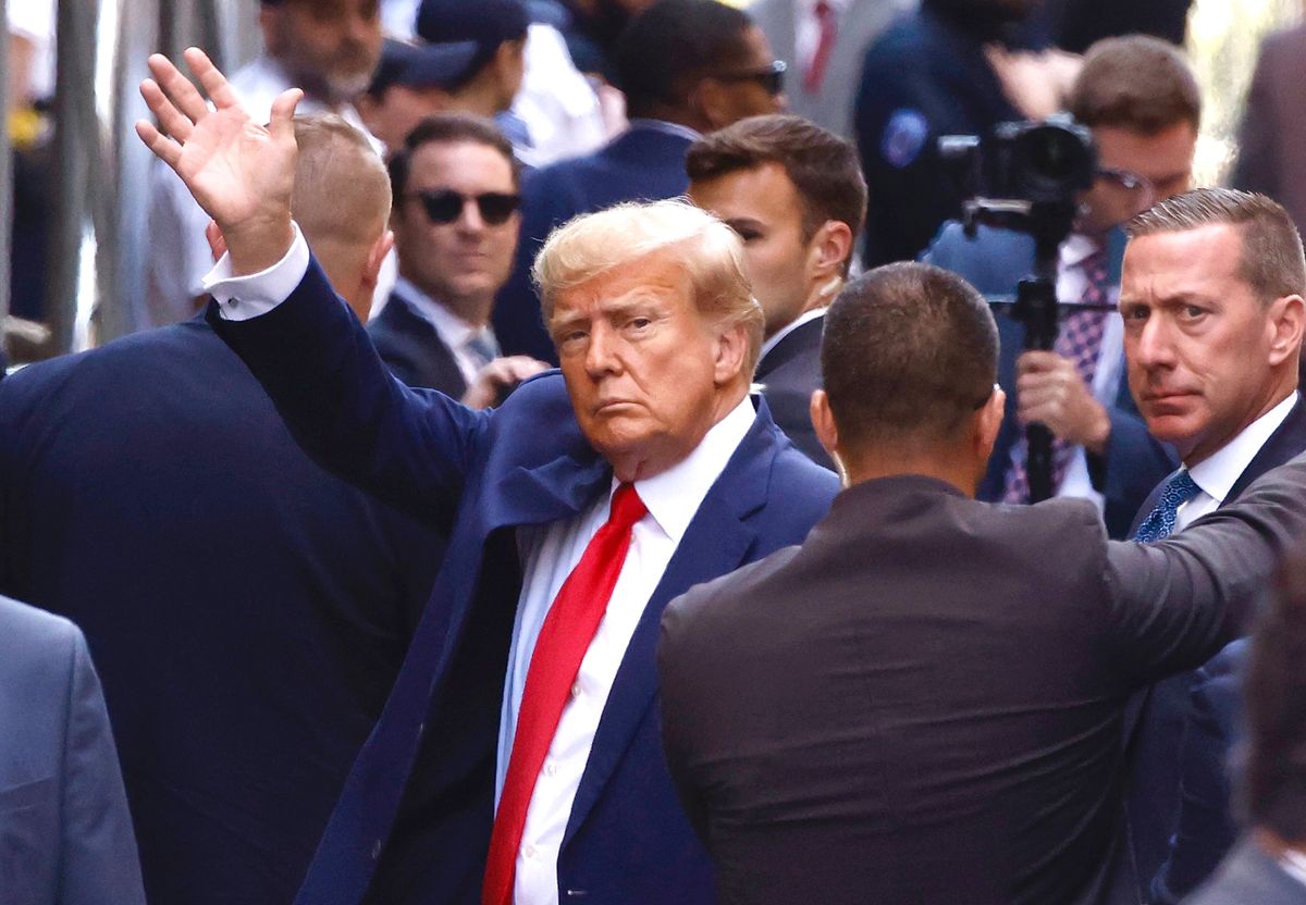 NEW YORK, NEW YORK - APRIL 04: Former U.S. President Donald Trump waves as he arrives at the Manhattan Criminal Court on April 04, 2023 in New York, New York.  Trump will be arraigned during his first court appearance today following an indictment by a grand jury that heard evidence about money paid to adult film star Stormy Daniels before the 2016 presidential election. With the indictment, Trump becomes the first former U.S. president in history to be charged with a criminal offense.