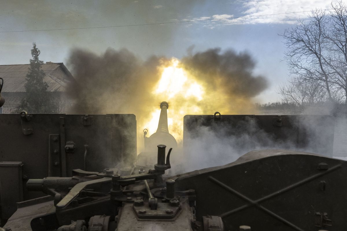 BAKHMUT, UKRAINE - APRIL 02: Ukrainian servicemen fire an artillery shell near the frontline area amid the Russia-Ukraine war, in Bakhmut, Ukraine on April 02, 2023. Muhammed Enes Yildirim / Anadolu Agency