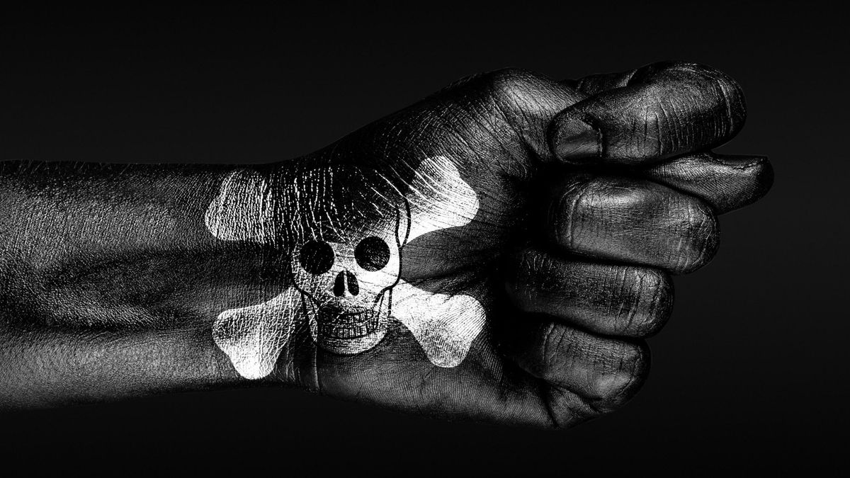 On,A,Hand,With,A,Painted,Human,Skull,And,Bones