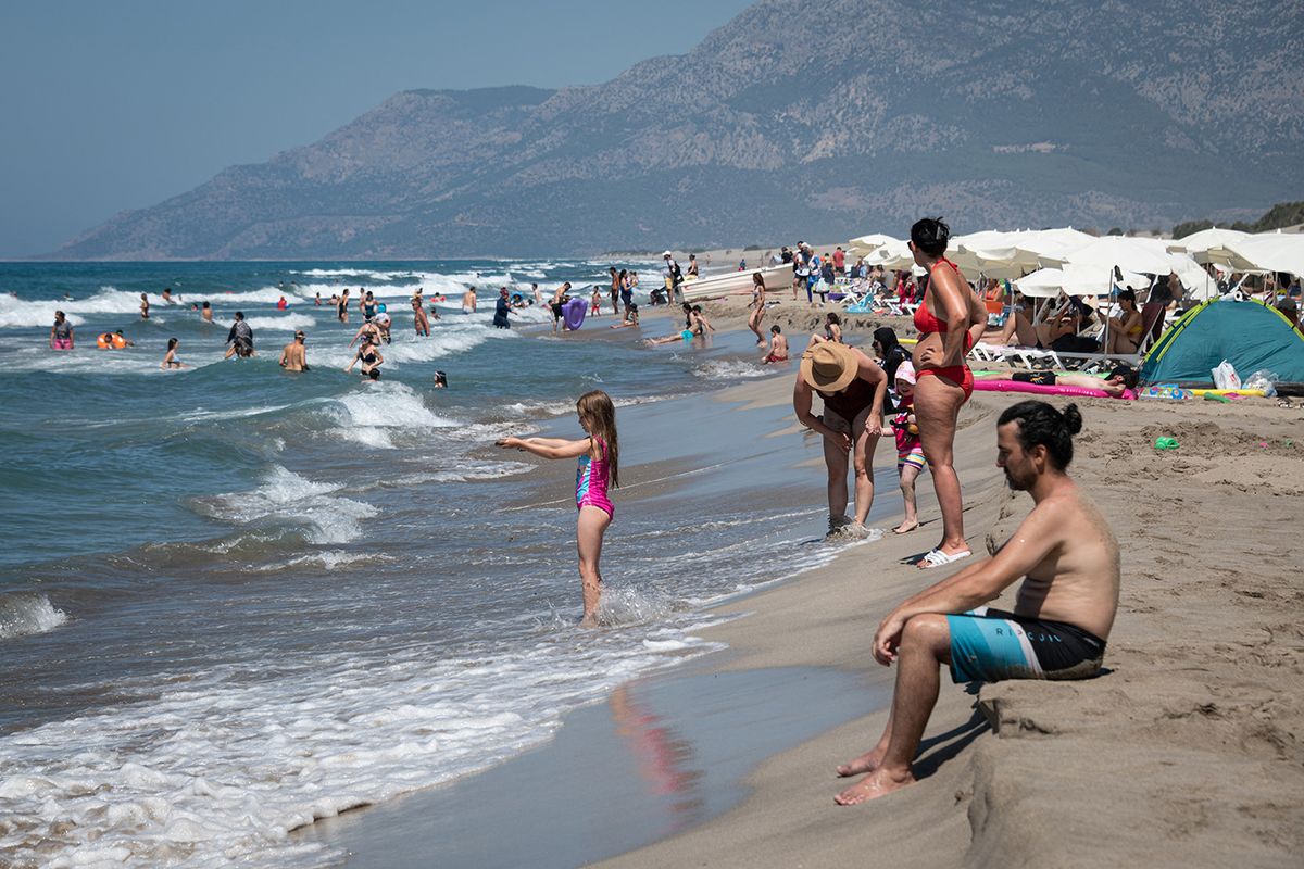 Tourists Visit Turkish Beaches Amid Covid-19 Pandemic
On 17 August, 2020, domestic and international tourists visited Patara beach in Turkey's Antalya district on the Mediterranean Sea, also known as the Turkish Riviera, despite an ongoing global coronavirus pandemic. (Photo by Diego Cupolo/NurPhoto) (Photo by Diego Cupolo / NurPhoto / NurPhoto via AFP)
Tourists Visit Turkish Beaches Amid Covid-19 Pandemic