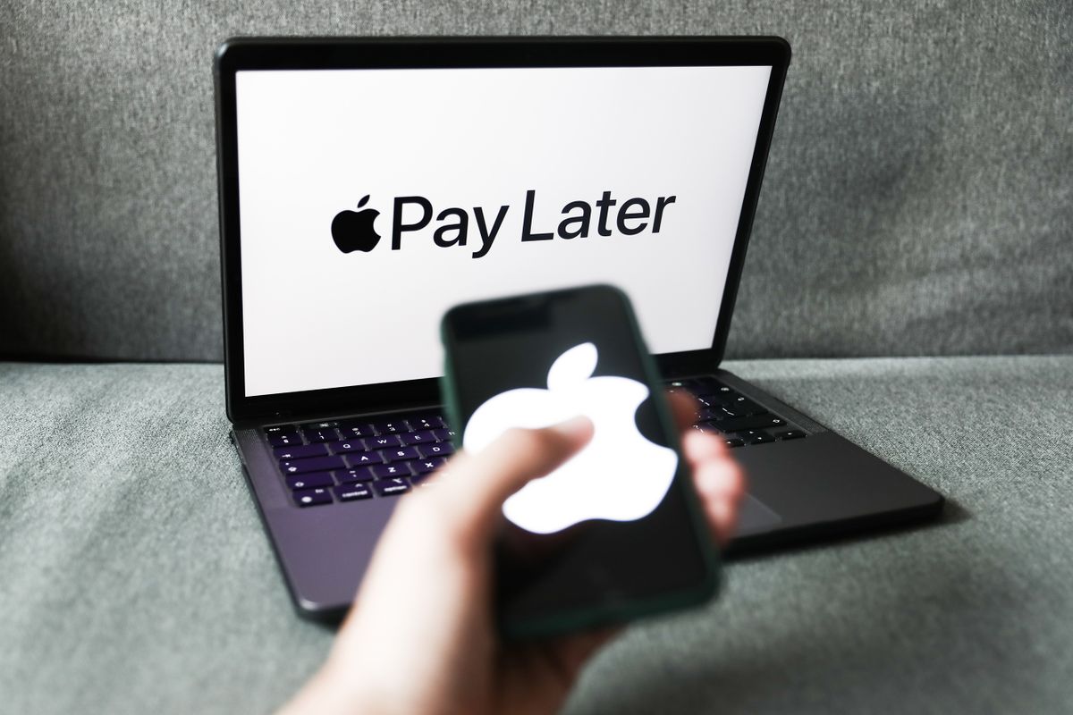 Apple Pay Later logo displayed on a laptop screen and Apple logo displayed on a phone screen are seen in this illustration photo taken in Krakow, Poland on June 7, 2022. 