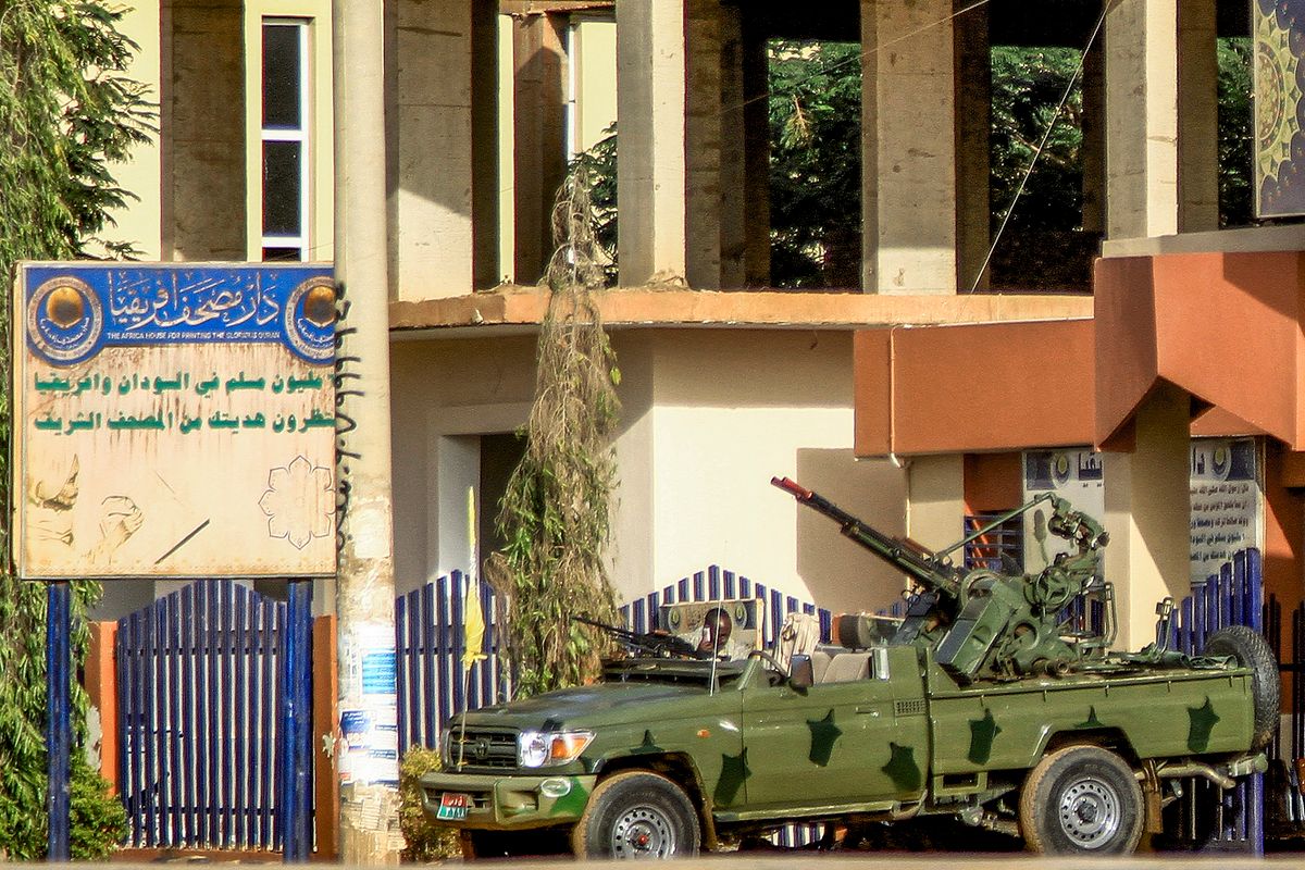 A "technical" vehicle (pickup truck mounted with turret) of Sudan's Rapid Support Forces (RSF) paramilitaries is stationed outside the offices of Dar al-Mushaf (African Holy Koran Publishing House), in the south of Sudan's capital Khartoum on April 17, 2023. 