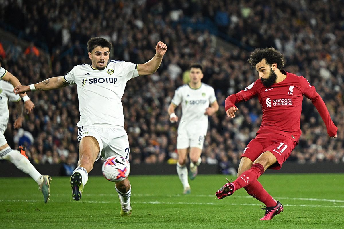 FBL-ENG-PR-LEEDS-LIVERPOOL
Liverpool's Egyptian striker Mohamed Salah (R) shoots to score their second goal during the English Premier League football match between Leeds United and Liverpool at Elland Road in Leeds, northern England on April 17, 2023. (Photo by Oli SCARFF / AFP) / RESTRICTED TO EDITORIAL USE. No use with unauthorized audio, video, data, fixture lists, club/league logos or 'live' services. Online in-match use limited to 120 images. An additional 40 images may be used in extra time. No video emulation. Social media in-match use limited to 120 images. An additional 40 images may be used in extra time. No use in betting publications, games or single club/league/player publications. /