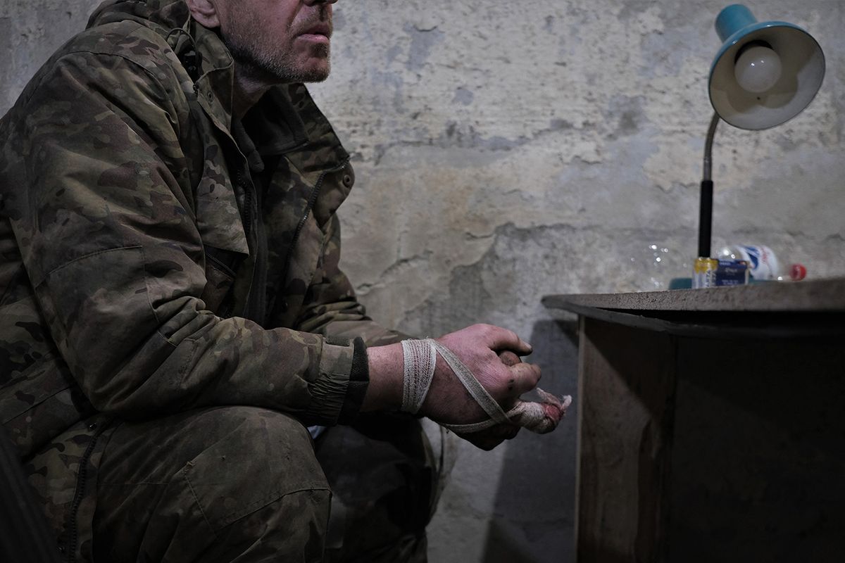 A member of the Russian paramilitary group Wagner and former criminal prisoner sits in the interrogation room after being captured by Ukrainian soldiers near Bakhmut, Donetsk region, on March 12, 2023, amid the Russian invasion of Ukraine. (Photo by Sergey SHESTAK / AFP)
UKRAINE-RUSSIA-CONFLICT-WAR-WAGNER