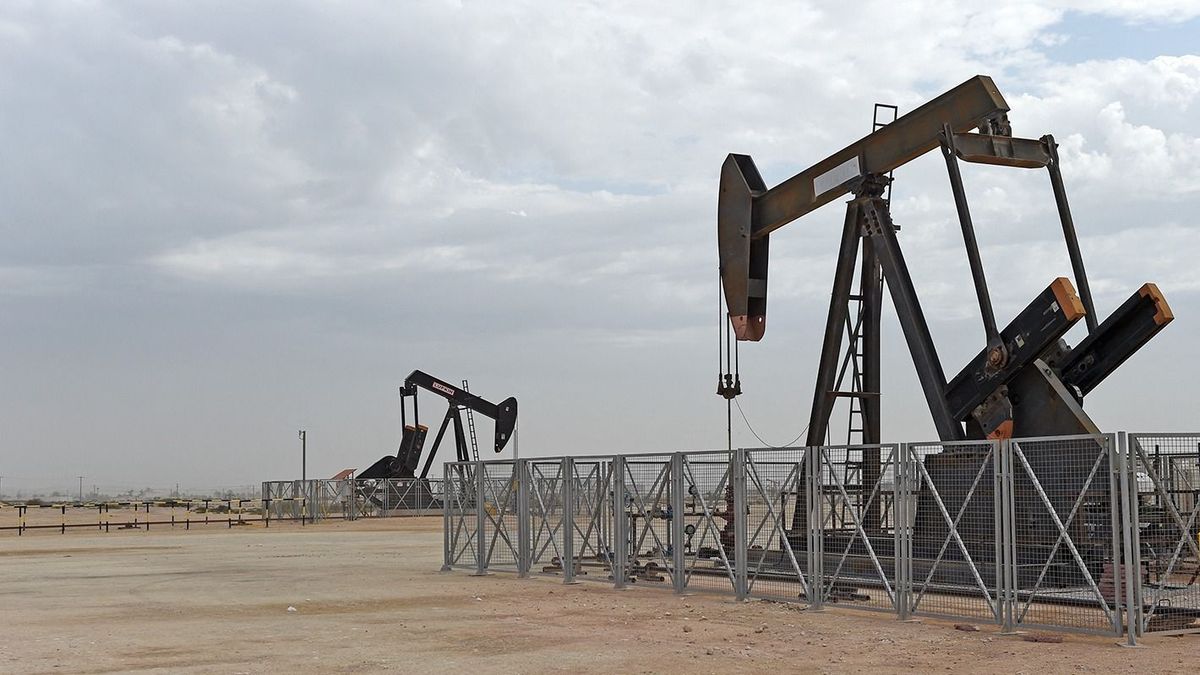 Pumpjacks operate in the desert oil fields of Sakhir in southern Bahrain on April 22, 2020. (Photo by Mazen Mahdi / AFP)