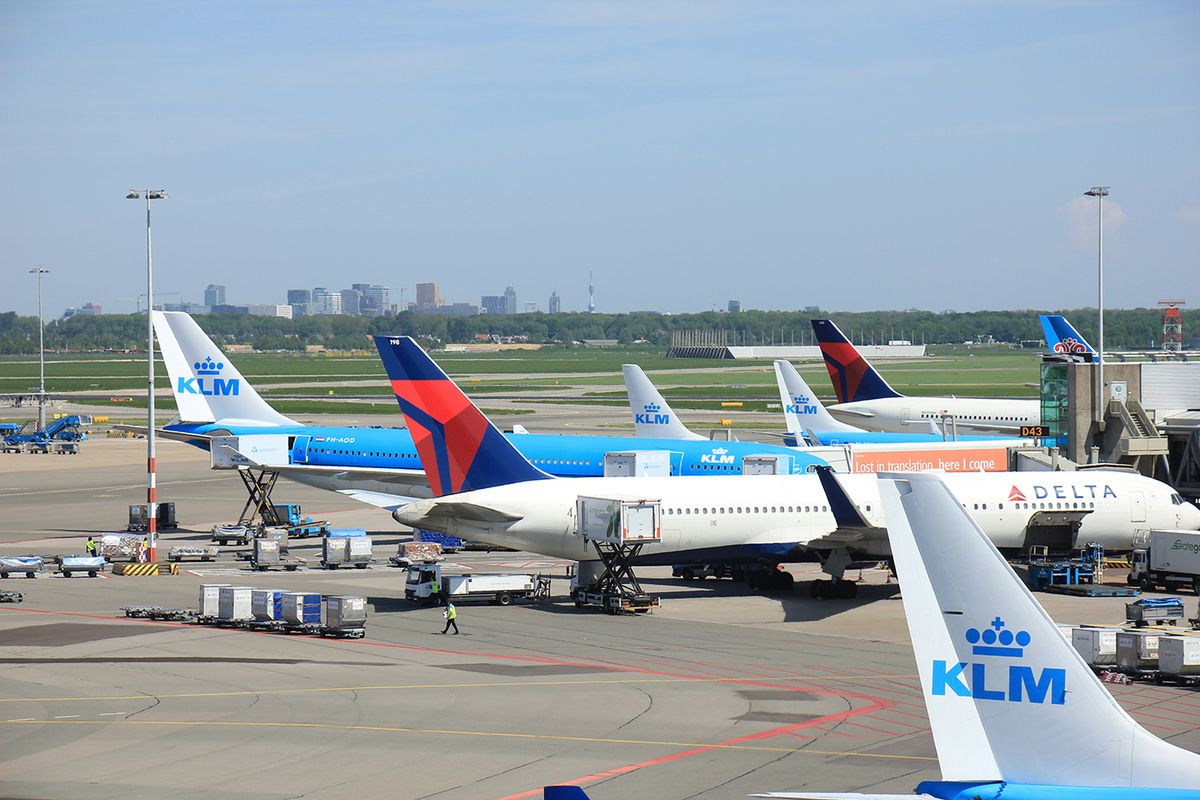 Amsterdam,The,Netherlands,-,May,13th,2016:,Planes,From,Delta
Amsterdam The Netherlands -  May 13th 2016: planes from Delta Airlines and KLM parked on Amsterdam Schiphol Aiport