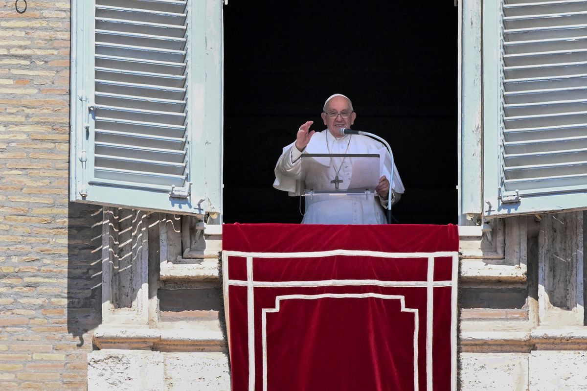 Pope Francis waves to attendees from the window of the apostolic palace overlooking St. Peter's square during the Regina Caeli prayer on April 16, 2023 in The Vatican. (Photo by Tiziana FABI / AFP)VATICAN-RELIGION-POPE-REGINA CAELI