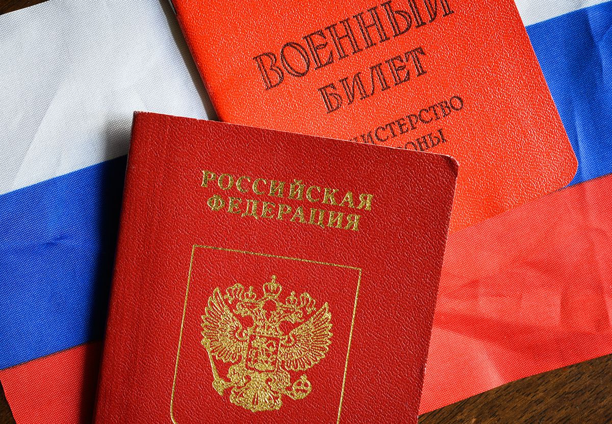 Russian,Passport,,Certificate,Of,Russia,Serviceman,And,Flag,On,Table,
Russian passport, Certificate of Russia serviceman and flag on table, top view. Concept of mobilization, war in Ukraine, service, duty and army. Translation: Russian Federation, Military ID card.