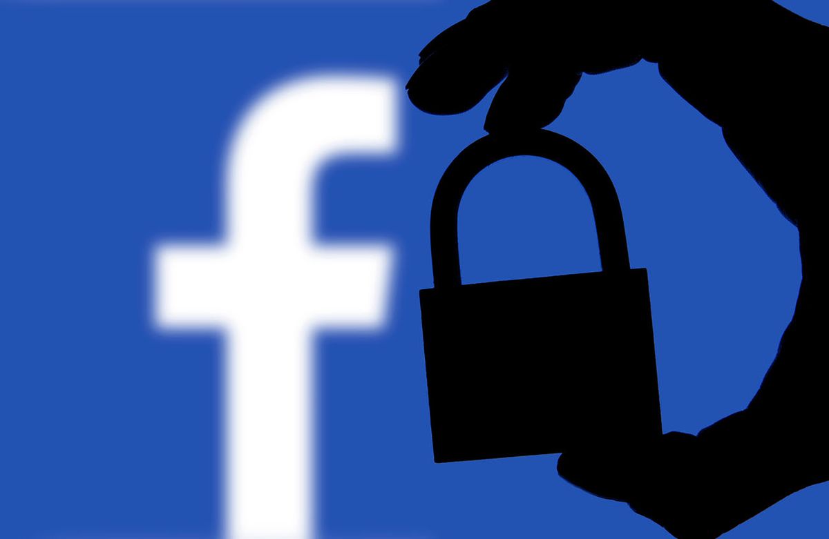London,,Uk,-,February,5th,2018:,Facebook,Security,Issues.,Silhouette
LONDON, UK - FEBRUARY 5th 2018: Facebook security issues. Silhouette of a hand holding a padlock infront of the facebook logo