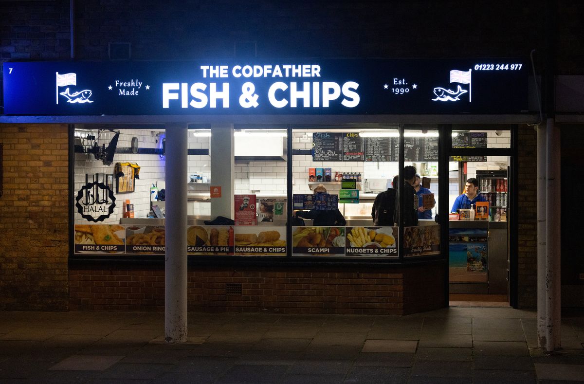 A Codfather fish and chip takeaway shop in Cambridge, UK, on ​​Thursday, April 13, 2023. Cambridge is an important part of the UK's aim to become a science and technology superpower by 2030 and the university's contribution to the local economy nearly four times what the Premier League makes foot. 