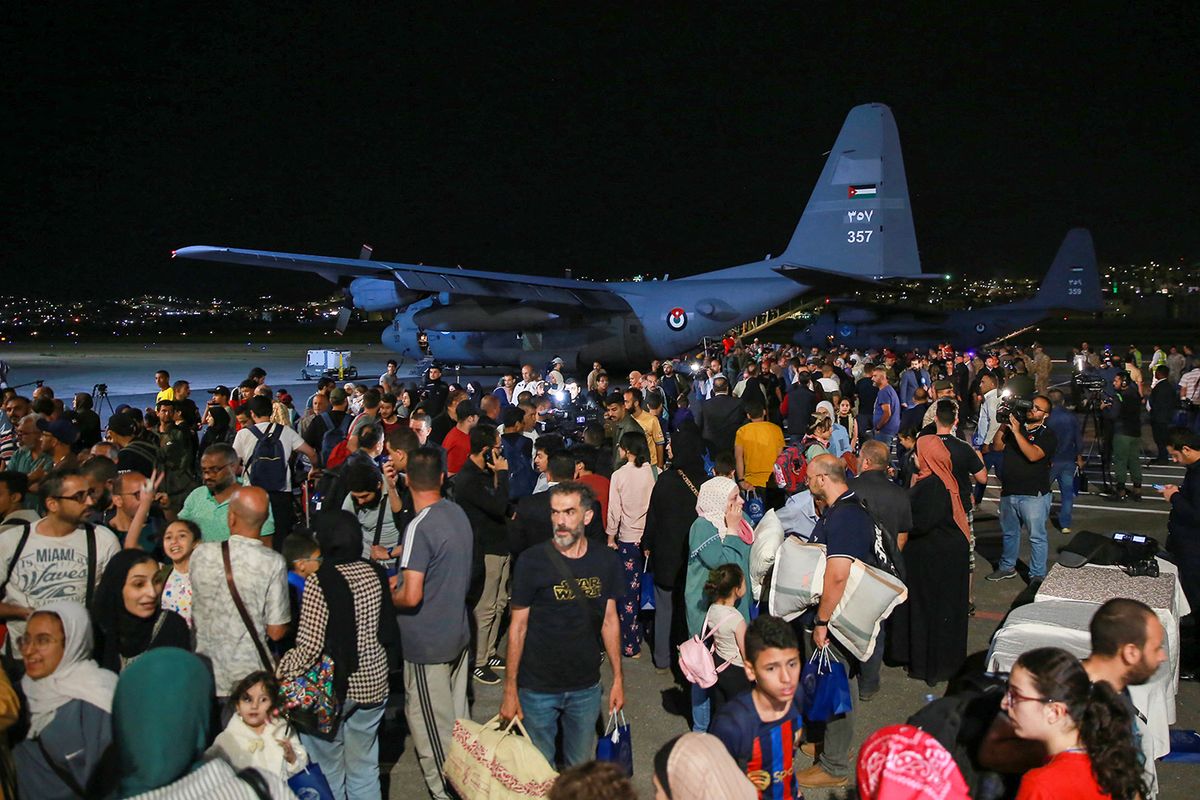 People evacuated from Sudan arrive at a military airport in Amman on April 24, 2023. - Foreign countries rushed to evacuate their nationals from Sudan as deadly fighting raged into a second week between forces loyal to two rival generals. (Photo by Khalil MAZRAAWI / AFP)
JORDAN-SUDAN-CONFLICT-EVACUATION