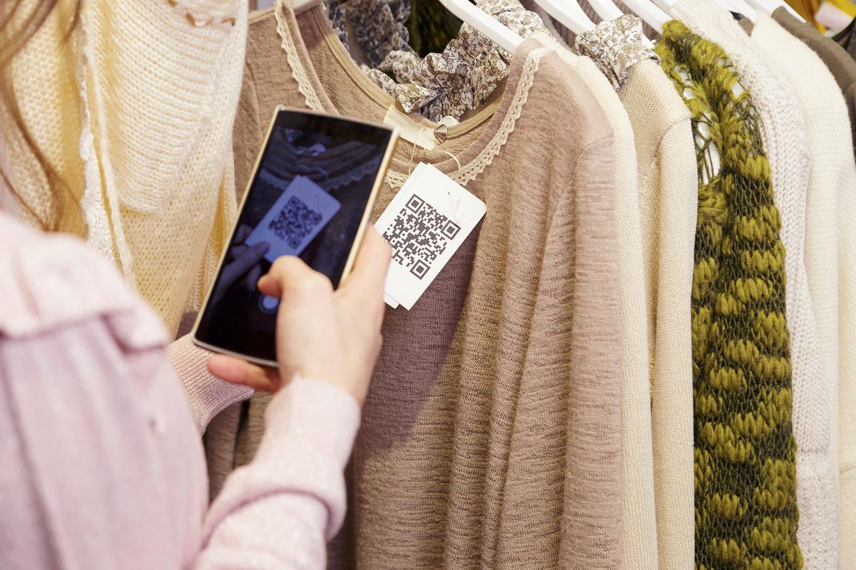 Woman,Scanning,A,Qr,Code,,With,Her,Smart,Phone,,From