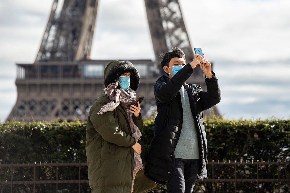 Tourists Wear Face Mask To Protect Against The Coronavirus In Paris
in Paris,in front of the eiffel tower,chinese tourists wear face mask to protect against the coronavirus ,with more and more people infected everyday ,and also in europe,chinese tourists wear protection mask, face mask against the contamination.A couple wearing a mask in the trocadero in front the eiffel tower (Photo by Jerome Gilles/NurPhoto) (Photo by Jerome Gilles / NurPhoto / NurPhoto via AFP)