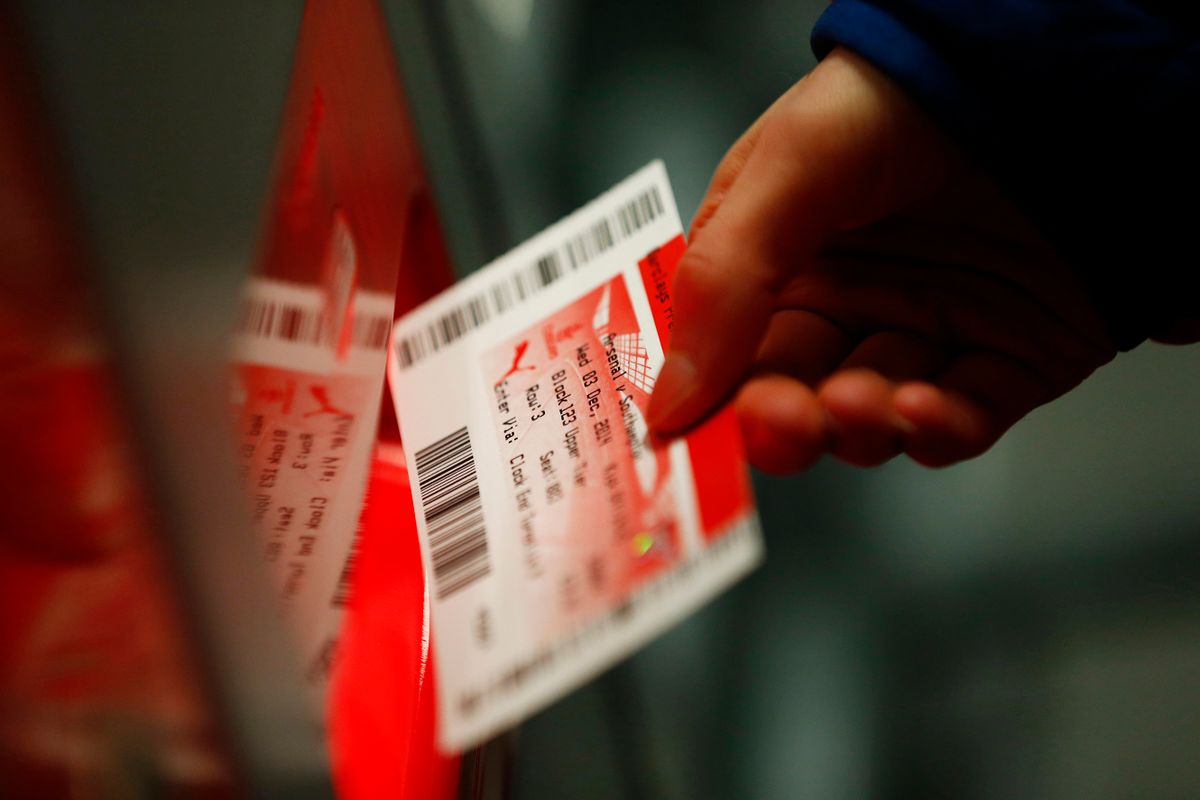 LONDON, ENGLAND - DECEMBER 03:  A supporter holds a ticket before the Barclays Premier League match between Arsenal and Southampton at Emirates Stadium on December 3, 2014 in London, England.