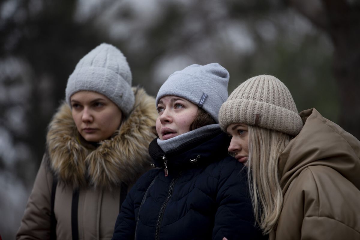 DNIPRO, UKRAINE - JANUARY 16: Relatives of the victims are seen as search and rescue operation continue in the region where civilians lost their lives in the missile attack, carried out by the Russian forces on the Ukrainian city of Dnipro, on January 16, 2023. 