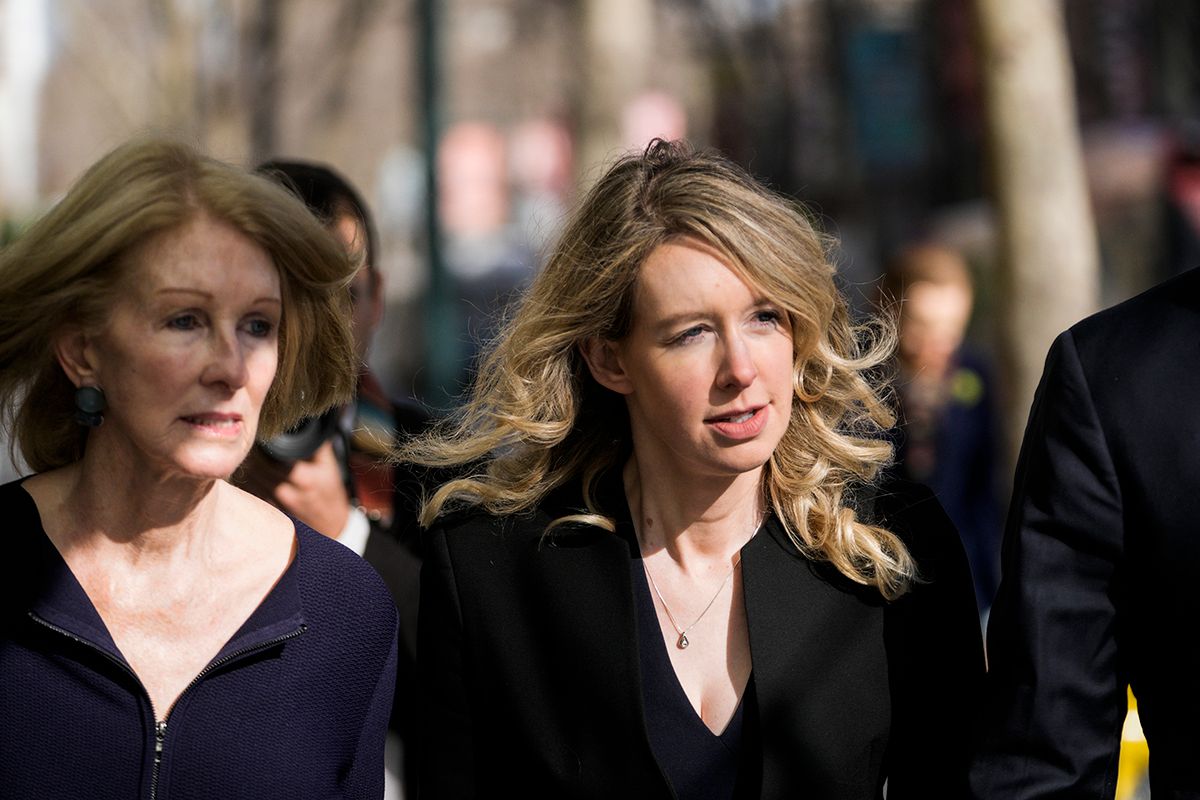 Disgraced Theranos Founder Elizabeth Holmes Appears In Court For A Restitution Hearing
SAN JOSE, CA - MARCH 17: Former Theranos CEO Elizabeth Holmes (C), alongside her mother Noel Holmes (L), makes her way to court on March 17, 2023 in San Jose, California. Holmes is appearing in court for a restitution hearing. (Photo by Philip Pacheco/Getty Images)