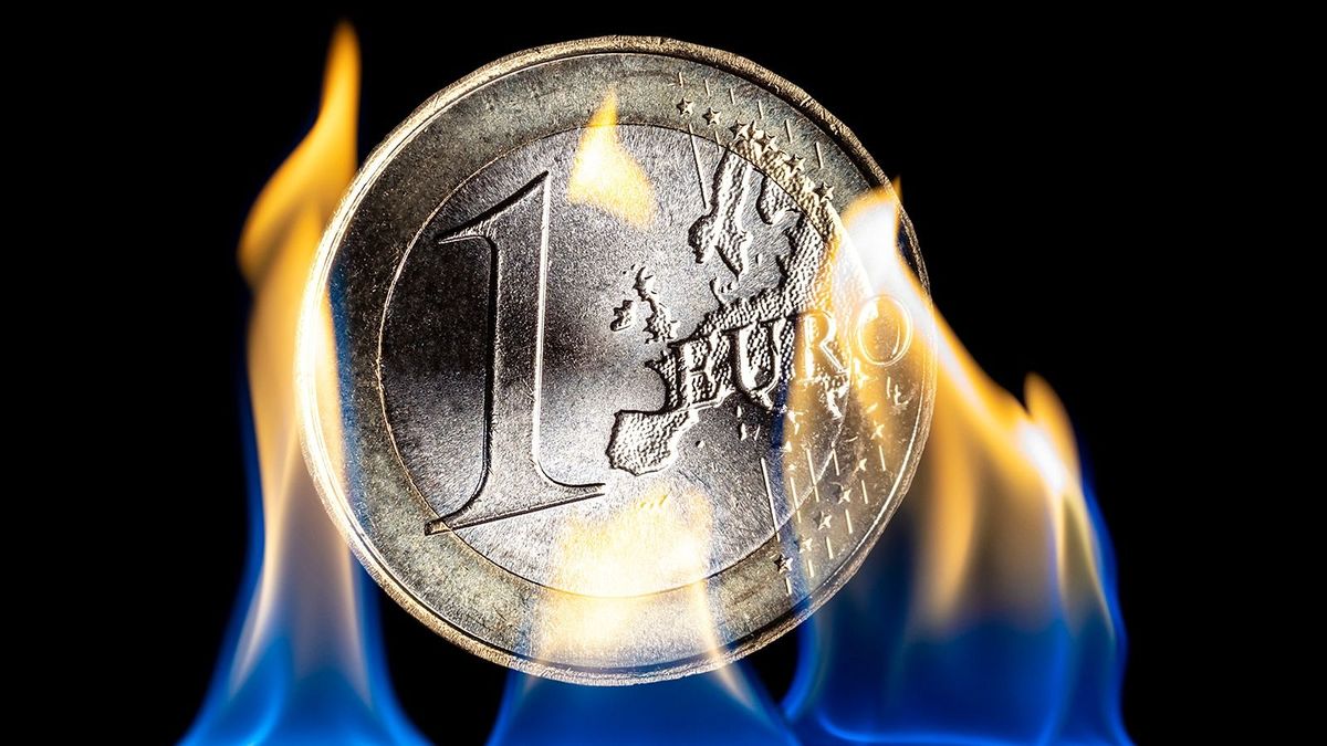 Flame produced by natural gas and burning one euro coins, burn money.
Concept of the price of money for the energy crisis of gas and fuels in the euro zone.