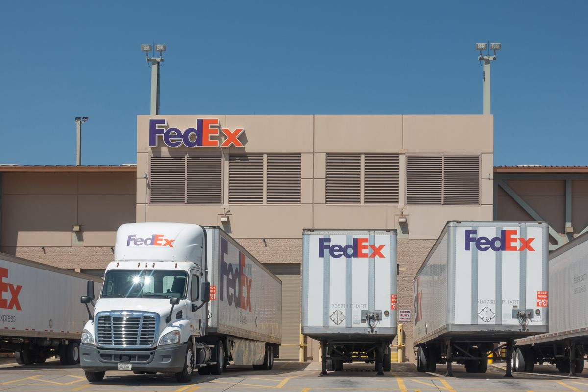 Phoenix,Az/USA - 8.16.19: Large FedEx delivery trucks at warehouse facility at SkyHarbor Airport in Phoenix.  FedEx is an American multinational courier delivery service headquater in Memphis, Tn.