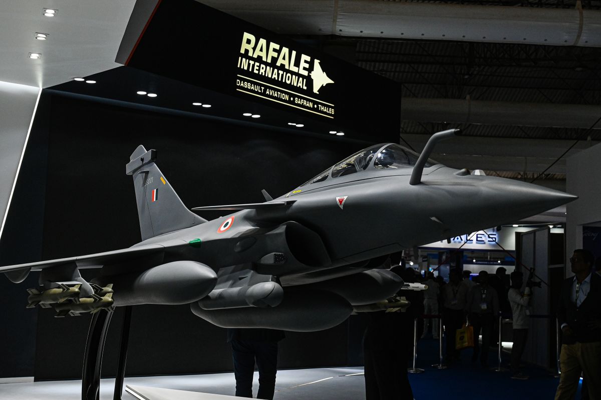 Models of Rafale fighter jet at Dassault Aviation SA booth during the Aero India 2023 at Air Force Station Yelahanka in Bengaluru, India, on Monday, Feb. 13, 2023. Indian Prime Minister Narendra Modi repeated at the opening of the five-day Aero India show his governments promise of boosting defense exports by more than 200% over the next three years as the South Asian nation looks to step up domestic manufacturing of military hardware. 