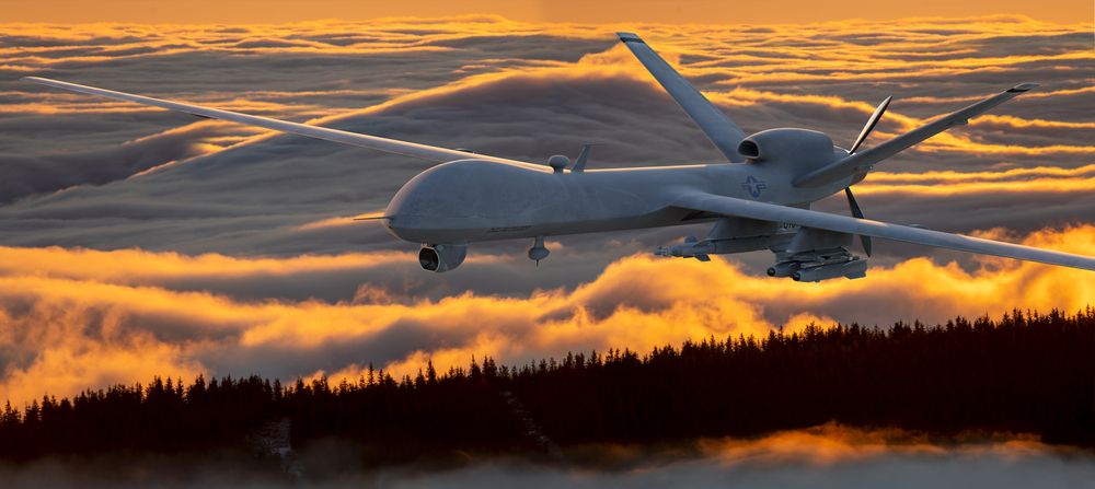 General,Atomics,Mq-9,Reaper,Drone,Flying,Over,The,Mountains,At