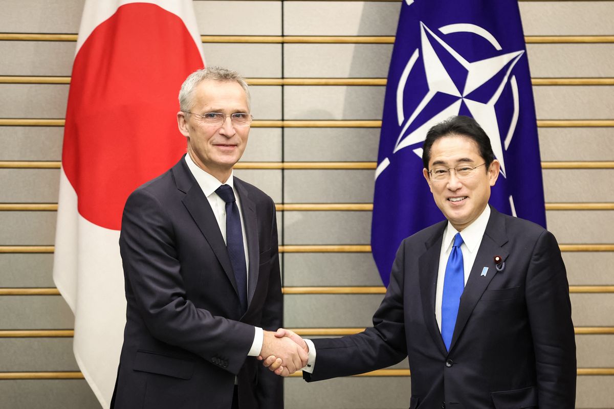 NATO Secretary-General Jens Stoltenberg (L) shakes hands with Japan's Prime Minister Fumio Kishida in Tokyo on January 31, 2023. 