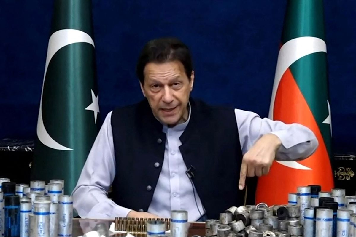 PAKISTAN-POLITICS-KHAN
This screengrab from Pakistan Tehreek-e-Insaf via AFPTV taken on March 15, 2023 shows former Pakistan prime minister Imran Khan issuing a video statement with a display of spent teargas canisters that he claims were fired into his home in Lahore. Pakistan police appeared on Match 15 to have given up an attempt to arrest Khan, ending a siege of his residence after violent clashes with hundreds of his supporters. (Photo by AFP/ Pakistan Tehreek-e-Insaf via AFPTV / AFP) / RESTRICTED TO EDITORIAL USE