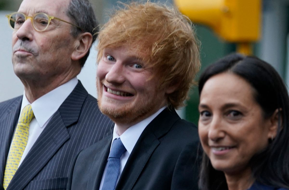 British singer-songwriter Ed Sheeran (C) departs Manhattan Federal Court in New York, on May 4, 2023. - British pop phenom Ed Sheeran did not plagiarize Marvin Gaye's "Let's Get It On" when composing his 2014 hit "Thinking Out Loud," a US jury ruled Thursday. 
