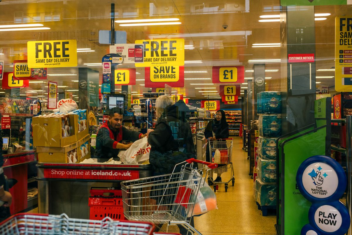 A customer at the checkout in an Iceland Foods Ltd. supermarket at Watney Market in the Tower Hamlets district of London, UK, on Saturday, March 18, 2023. The Office for National Statistics are due to release the latest UK CPI Inflation data on Wednesday. 