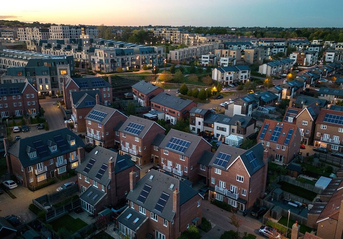 Sustainable Housing Development
Aerial view of modern solar powered housing development at dusk