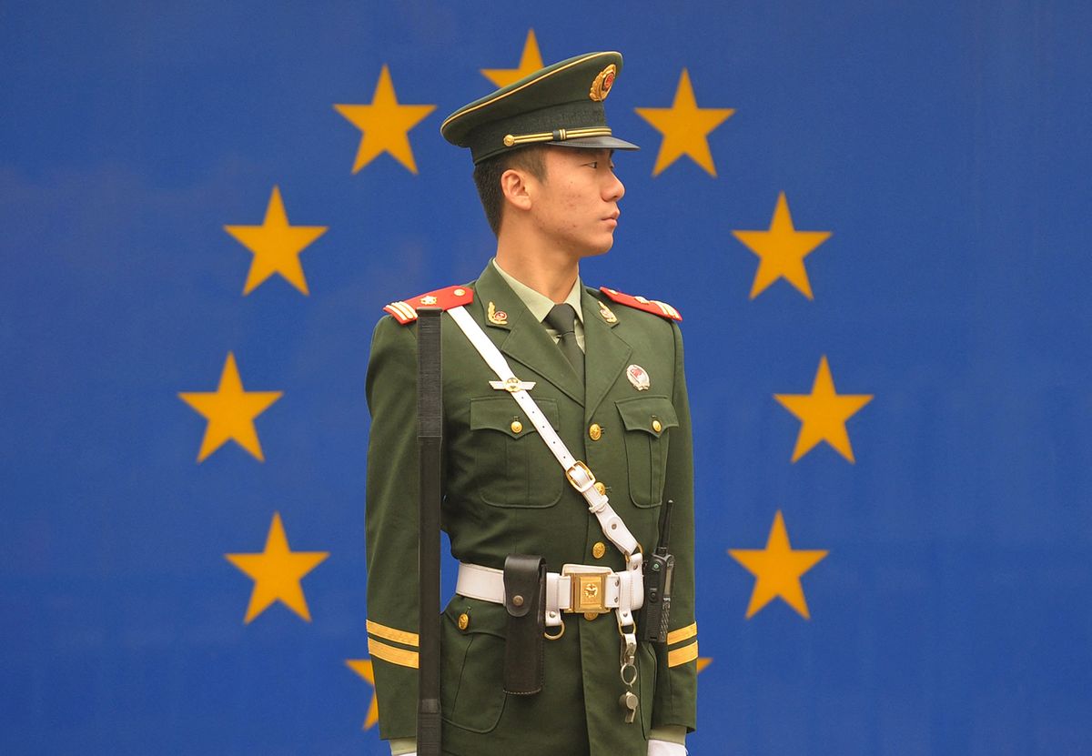 TO GO WITH Finance-economy-public-debt-EU-China,FOCUS by Bill SavadoveA Chinese paramilitary policeman stands guard outside the European Union Delegation in Beijing on October 30, 2011.  Europe has set its sights on Beijing as it tries to haul itself out of a debt crisis, but many Chinese people are asking why they should bail out wealthier nations that have lived beyond their means.    AFP PHOTO / Peter PARKS (Photo by PETER PARKS / AFP)