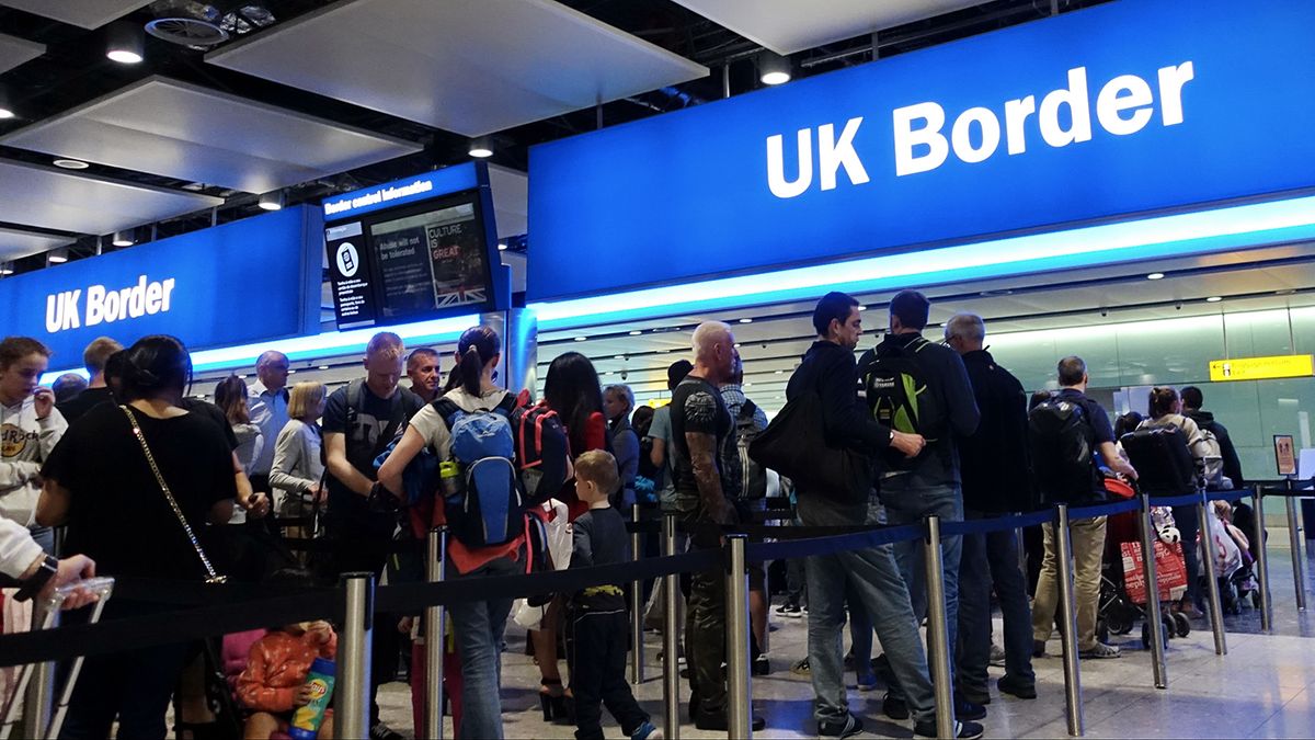 London, UK - August 24, 2018: Air travelers queue at border control at Heathrow Airport. EU passengers face uncertainty as the UK is due to leave the EU in 2019 with a no deal on brexit possible.