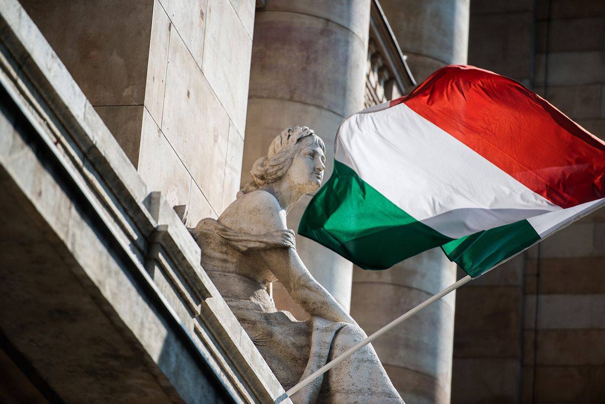 General Economy As Hungary Posts Quarterly Growth A Hungarian national flag flies outside the Hungarian central bank, also known as Magyar Nemzeti Bank, in Budapest, Hungary, on Wednesday, May 15, 2013. Hungary's economy posted quarterly growth in the first three months of the year for the first time since 2011, helped by an increase in construction output. Photographer: Akos Stiller/Bloomberg via Getty Images