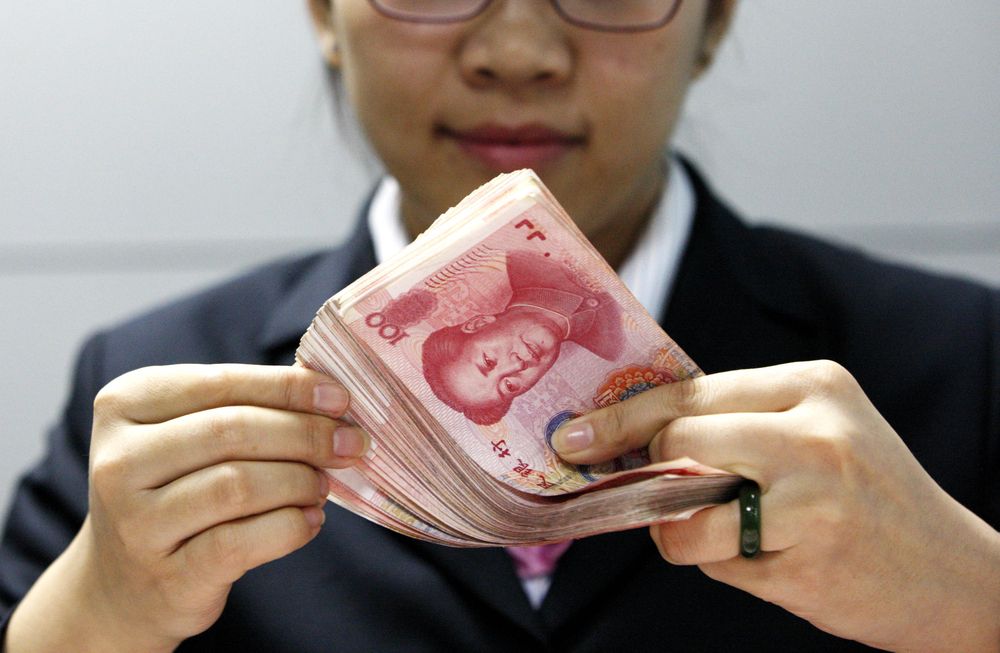 A,Chinese,Clerk,Counts,Rmb,(renminbi),Yuan,Banknotes,At,A
