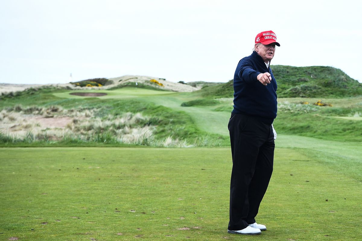 Former US President Donald Trump reacts as he plays golf at the Trump Turnberry Golf Courses, in Turnberry on the west coast of Scotland on May 2, 2023, during the second day of his first visit to the country since losing the Presidency.