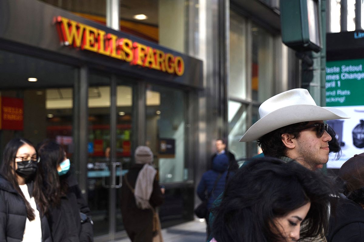Large US Banks Experience Influx Of New Depositors People walk past a Wells Fargo Bank in Midtown on March 15, 2023 in New York City, USA. Small lenders experience tumultuous setbacks as large US banks including Jp Morgan Chase, Bank of America, Wells Fargo and Citigroup see an increase of new accounts as depositors shift their assets in view of the Silicon Valley Bank and Signature Bank collapse. Large financial institutions including money market funds struggle to stay on top of the influx of new applications, sometimes “.”initiating money transfer procedures while the new client is still undergoing compliance checks. Government regulators stepped in assuring SVB investors access to their accounts in an effort to sustain public confidence in the US banking system. (Photo by John Lamparski/NurPhoto) (Photo by John Lamparski / NurPhoto / NurPhoto via AFP)