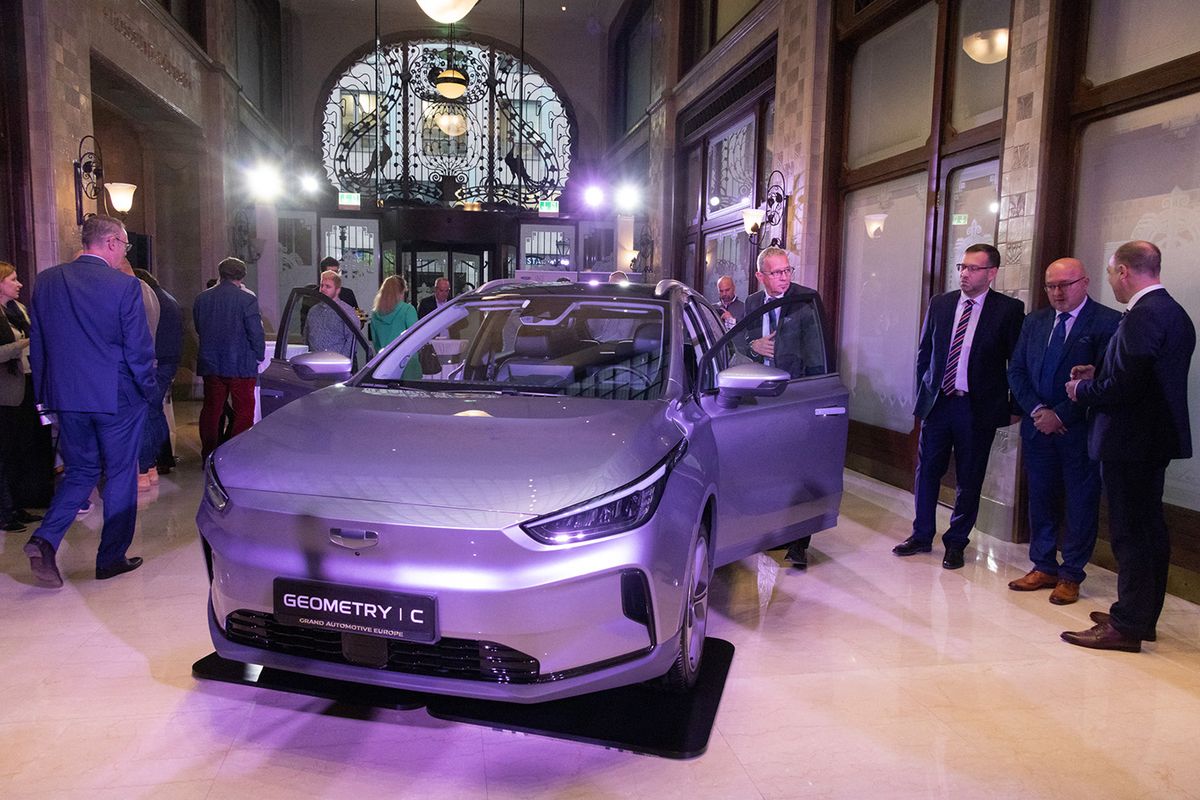 HUNGARY-BUDAPEST-CHINESE AUTOMAKER-GEELY-EU-MARKETHUNGARY-BUDAPEST-CHINESE AUTOMAKER-GEELY-EU-MARKET(221104) -- BUDAPEST, Nov. 4, 2022 (Xinhua) -- A Geely's Geometry C electric car is seen on display before the signing ceremony in Budapest, Hungary, on Nov. 4, 2022. Chinese automaker Geely Auto Group has entered the European Union (EU) market by signing an agreement with Hungarian car importer Grand Automotive Central Europe (GACE) here on Friday. (Photo by Attila Volgyi/Xinhua) (Photo by Attila Volgyi / XINHUA / Xinhua via AFP)